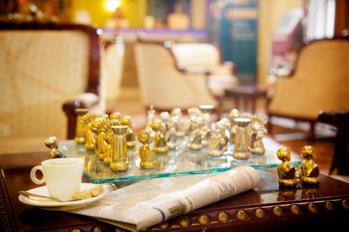 a table topped with cups filled with coffee at Hotel Mandarin in Moscow