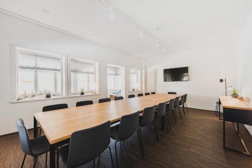 a large conference room with a long table and chairs at Hotel Villa Bodeblick in Schierke