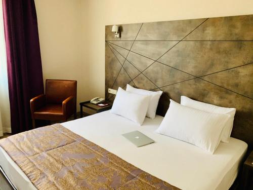 Postel nebo postele na pokoji v ubytování Hostapark Hotel