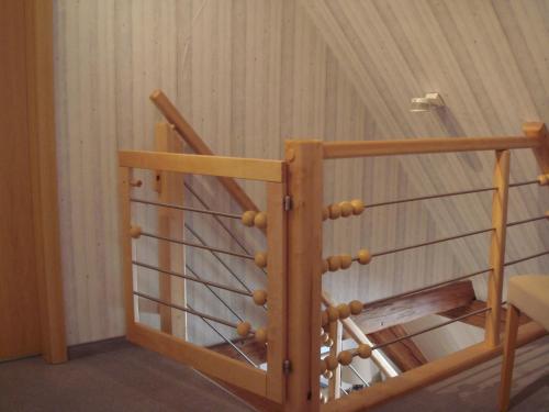 a wooden spiral staircase in a room at Haus am Markt in Königstein in der Oberpfalz
