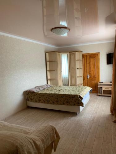 Кровать или кровати в номере Бухточка