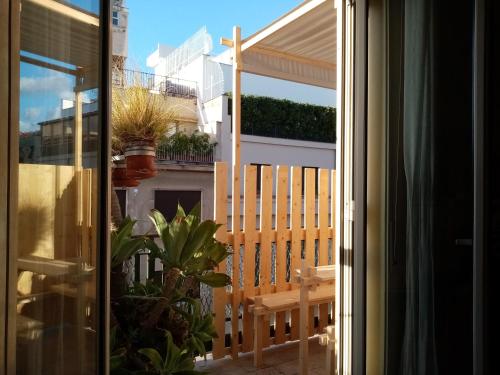 a view of a balcony from a window with a bench at Ariston Petit Hotel in Palermo