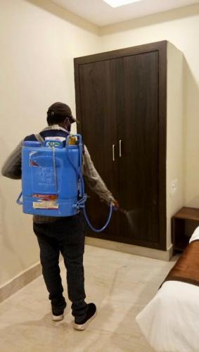 a man with a back pack is opening a cabinet at New Hotel Suhail in Hyderabad