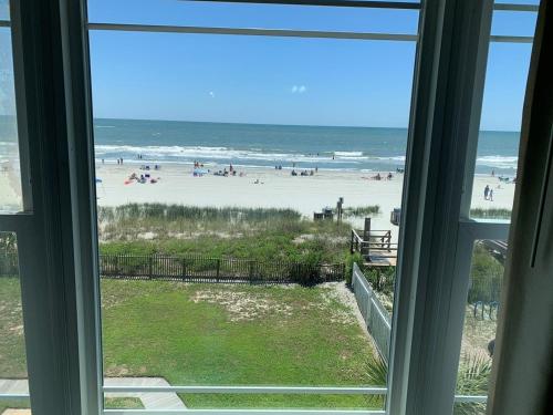 a view of the beach from a window at Boston Commons 201 Condo in Myrtle Beach