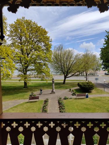 a view of a park with trees and a person riding a bike at Villa OLD POST in Juodkrantė