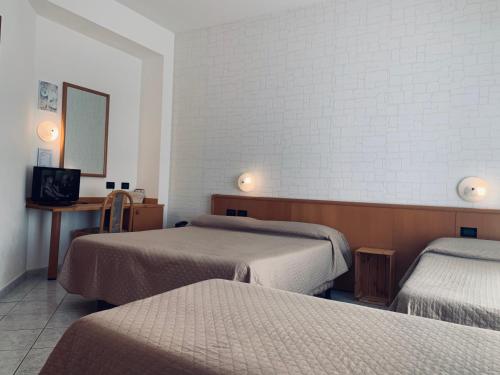 Кровать или кровати в номере Hotel San Giorgio
