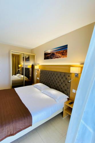 Ένα ή περισσότερα κρεβάτια σε δωμάτιο στο Hotel Tettola