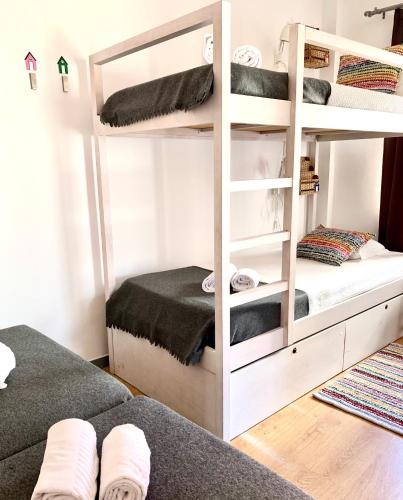 a bunk bed room with two bunk beds in it at Peneco Albufeira GuestHouse in Albufeira