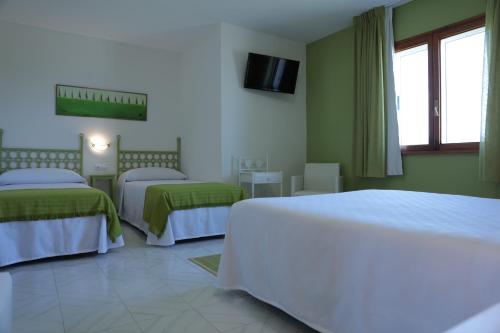 מיטה או מיטות בחדר ב-Hotel Las Catedrales