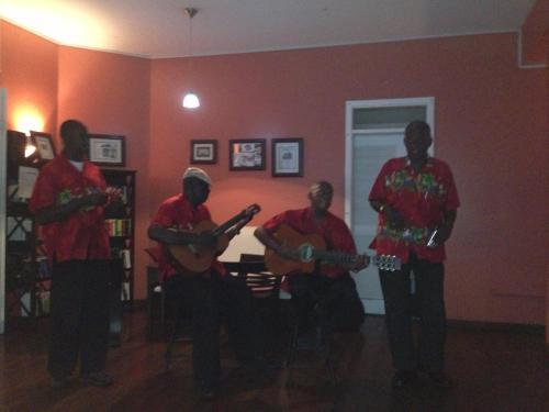 a group of men playing guitars in a room at Blue Haven Hotel - Bacolet Bay - Tobago in Scarborough
