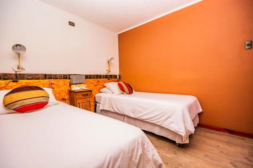 Tempat tidur dalam kamar di Hotel Casa Algarrobo