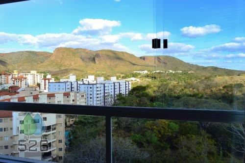a view of a city with mountains in the background at Park Veredas - Apto 526 - Flat Service in Rio Quente