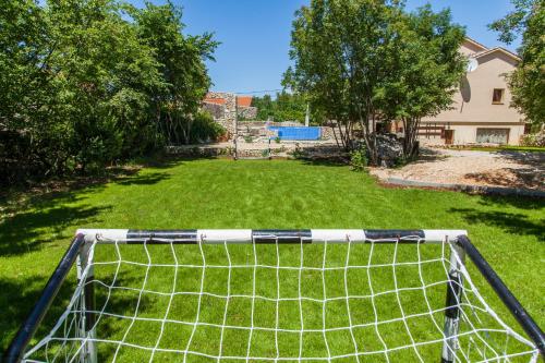 a soccer goal in the middle of a yard at Villa Nabucco in Kras