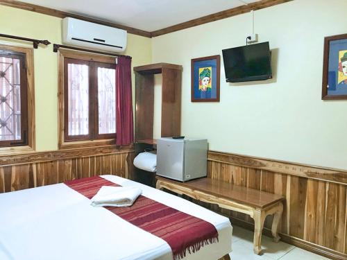 Ένα ή περισσότερα κρεβάτια σε δωμάτιο στο Apple Guesthouse