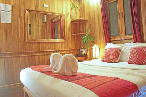 Ένα ή περισσότερα κρεβάτια σε δωμάτιο στο Apple Guesthouse