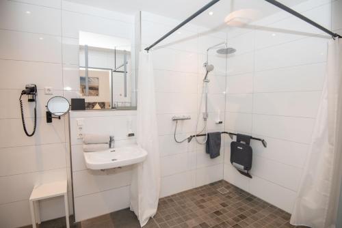 Ванная комната в Hotel Jann von Norderney