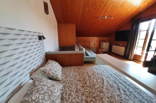 a bedroom with a large bed in a room at MAS BLANC in Calafell