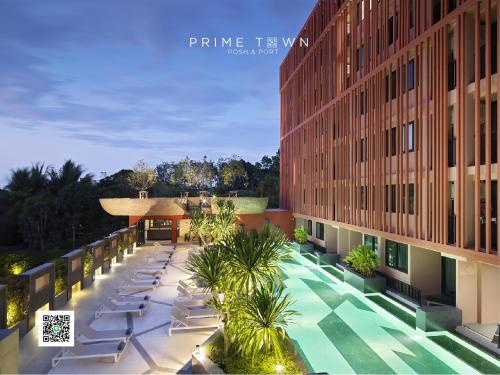 an overhead view of a building with chairs and trees at PRIME TOWN - Posh & Port Hotel PHUKET in Phuket