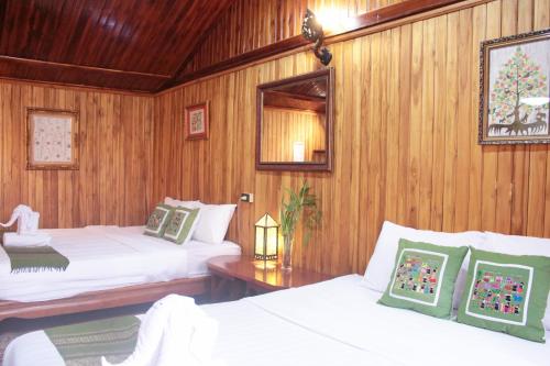 Ένα ή περισσότερα κρεβάτια σε δωμάτιο στο Apple Guesthouse