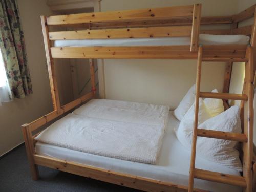 a bunk bed in a room with a bunk bed frame at Ferienwohnung Embacher in Söll