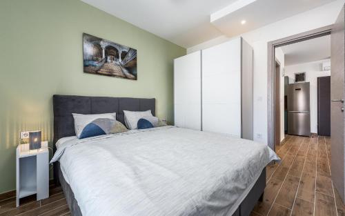 Postel nebo postele na pokoji v ubytování Apartment Sabbia