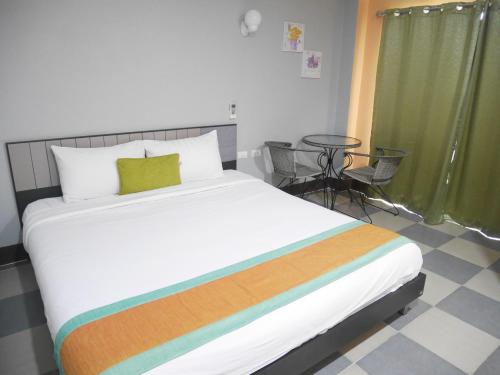 Postel nebo postele na pokoji v ubytování Nasa Hotel