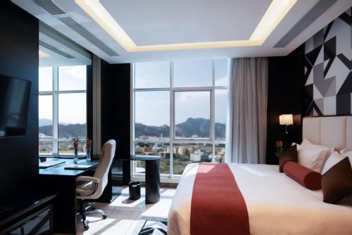 Katil atau katil-katil dalam bilik di Bayat Suites