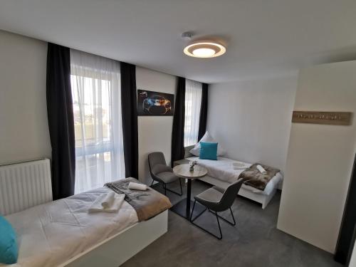 Ένα ή περισσότερα κρεβάτια σε δωμάτιο στο HP Apartments