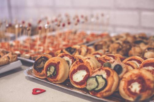 a bunch of different types of pastries on a table at Club Meeting Hotel in Rimini