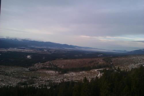 a view of a city from the top of a mountain at Apartman Panorama 1001 in Štrbské Pleso