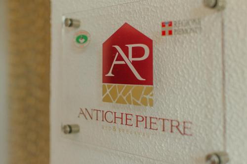 a picture of an alphabet picture on a lightswitch at b&b Antiche Pietre in Bollengo