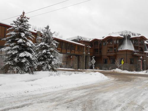 a snow covered street in front of a lodge at Lodge at Whitefish Lake in Whitefish