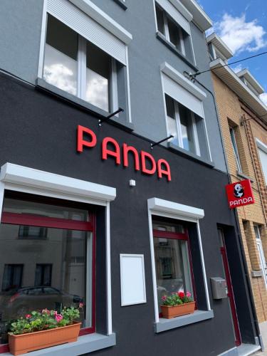 
a building with a sign on the front of it at Panda Stella in Zaventem
