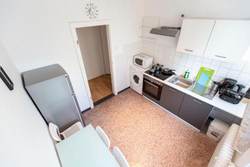 Kuchyň nebo kuchyňský kout v ubytování AVR Apartment Geestemunde 3