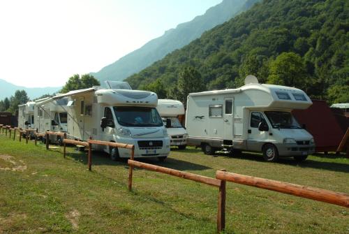 a group of rvs parked in a field at Rafting Center Drina Tara in Bastasi