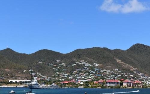 a town on a hill with boats in the water at Travel Inn Hotel Simpson Bay in Simpson Bay