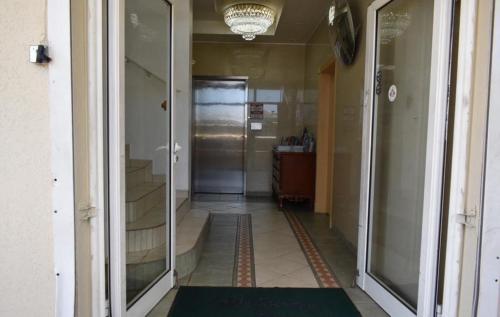 a hallway with a hallway leading to a room with a door at Travel Inn Hotel Simpson Bay in Simpson Bay