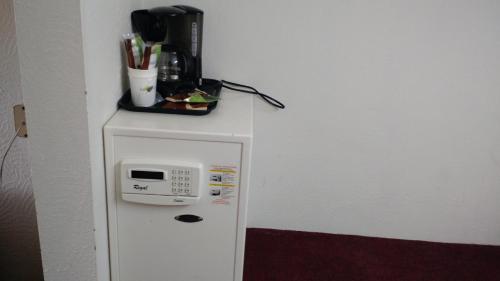 a small refrigerator with a microwave on top of it at Sprucewood Inn in Elyria