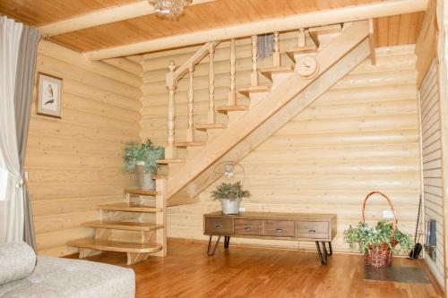 a room with a staircase and a wooden wall at Villa Camilla, Затока in Zatoka