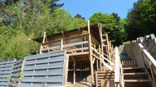 a house being constructed with wooden stairs at La tente de la plage in Plouha