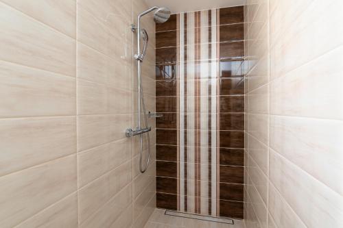 a shower with a glass door in a bathroom at Villa Rotonda in Vrsar