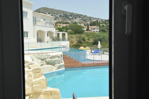 a view of a swimming pool from a door at Tala Luxury apartments with pool by Raise in Tala