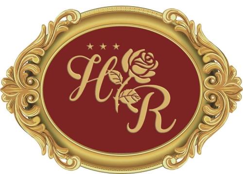 a gold picture frame with a rose in it at Hotel Róża in Kamieniec Wrocławski