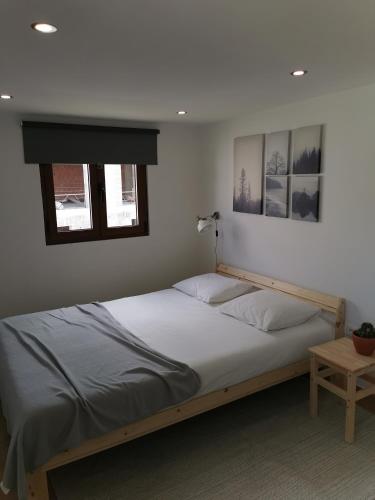 a bedroom with a bed and a window at Casa Mendes Lopes in Celorico de Basto
