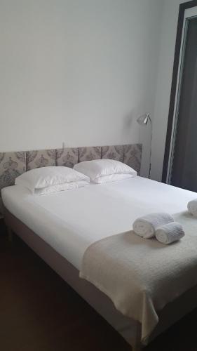 Postel nebo postele na pokoji v ubytování Rosa Biscoito Suites