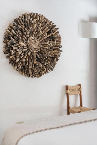 a picture of a wall decoration on a wall at Tierra del Mar Hotel - Adults Only in Holbox Island