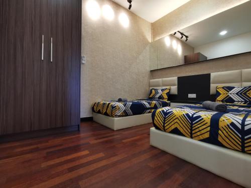 Un pat sau paturi într-o cameră la Thermospace Silverscape A-19-01 Melaka City