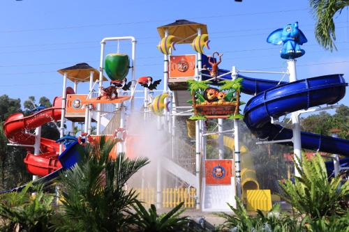 a group of water slides at a water park at Bukit Merah Laketown Resort in Taiping