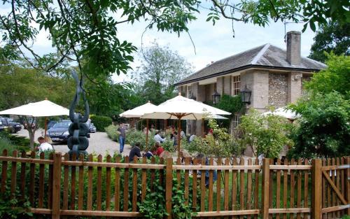 a wooden fence in front of a house at The King's Head in Holt