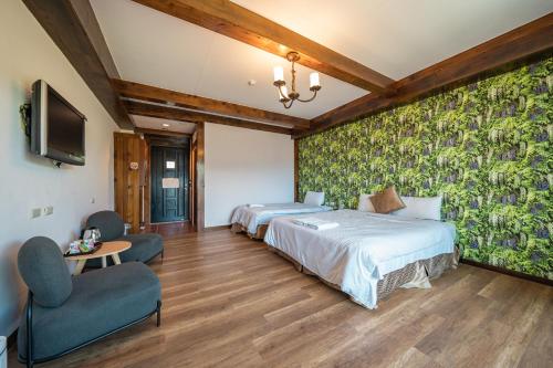 Cama o camas de una habitación en 清境英格曼花園民宿